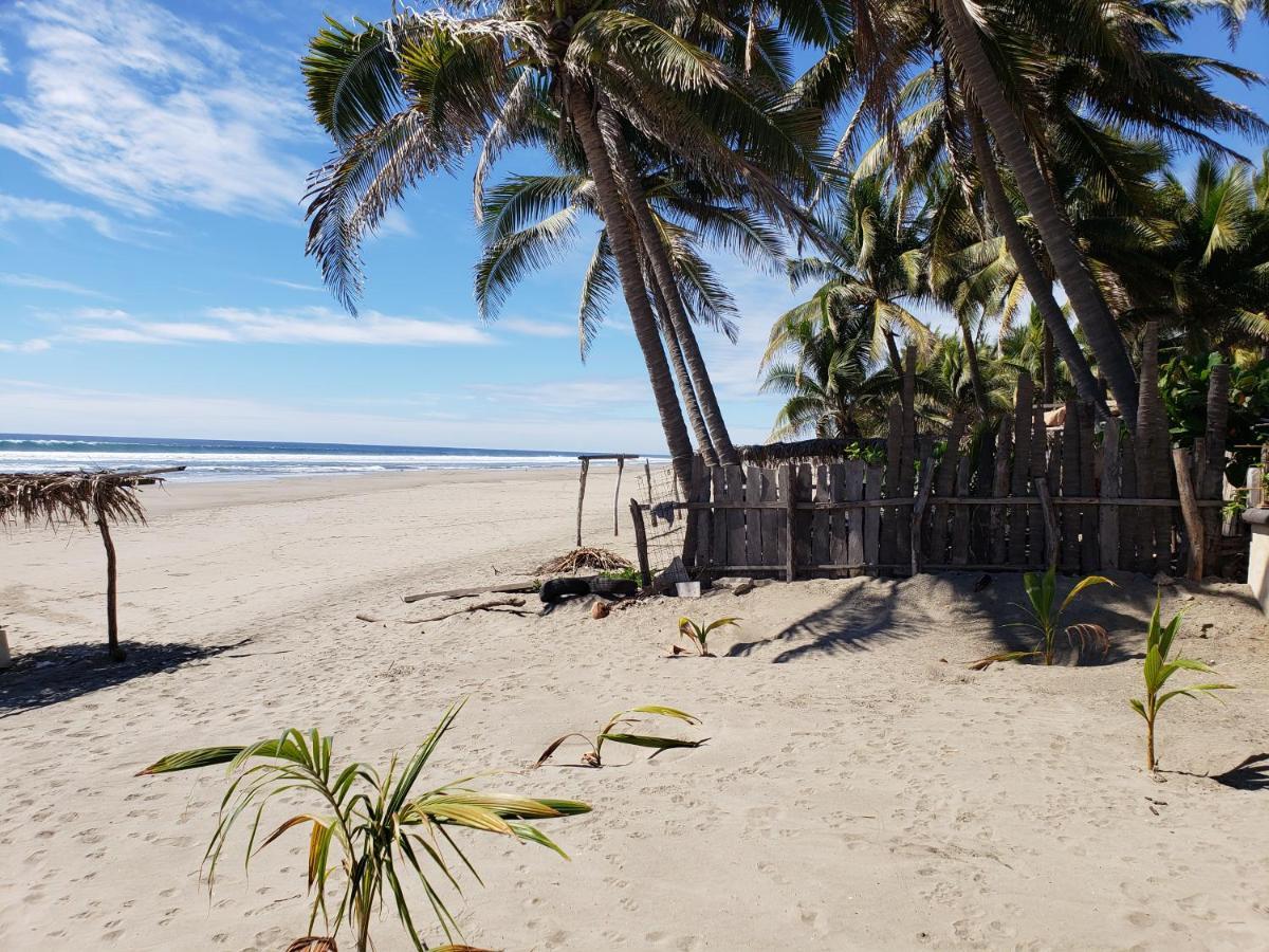 Bungalows La Perla Playa Azul Esterno foto